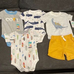 Three 12 month onesies and a shorts set.